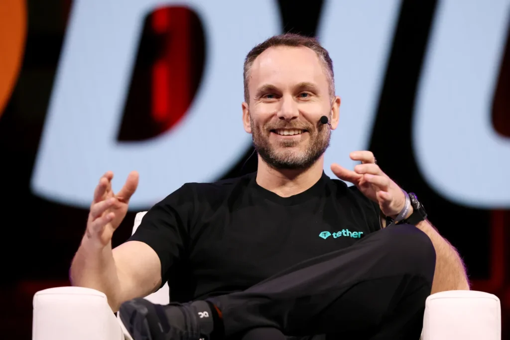 Read more about the article Tether USAT Stablecoin Marks a U.S. Comeback as Paolo Ardoino Takes on Regulators, Rivals, and Critics